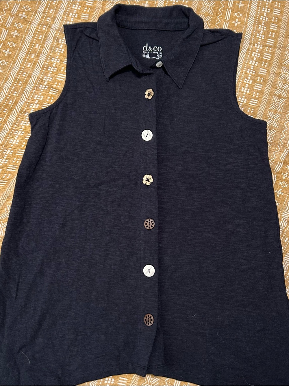 d&co Sleeveless Button-Down Shirt in Black with a variety of cute buttons